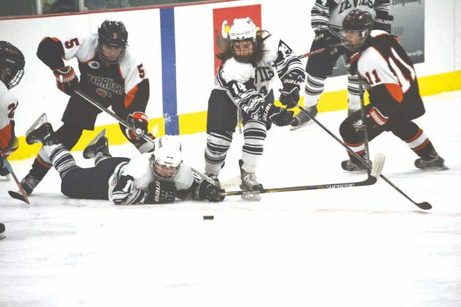 Sault High’s Hunter Krause (10) takes a faceoff and Abby Roque (14) chases the puck during a game against Birmingham Brother Rice at the Lions Cup Showcase Saturday at Pullar Stadium. Brother Rice defeated the Sault 4-3 in overtime. The Blue Devils play again today at 2:30 against Plymouth at the Pullar.