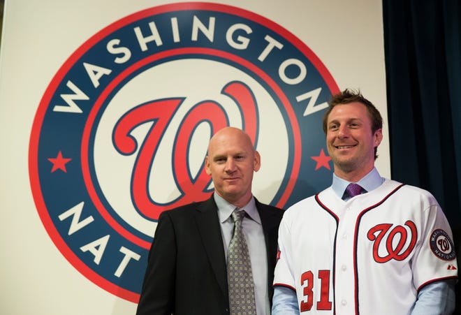 Nationals manager Matt Williams, left, stands with pitcher Max Scherzer Wednesday during an introductory news conference at Nationals Park in Washington. Scherzer signed a $210 million, seven-year contract to join the Nationals. THE ASSOCIATED PRESS