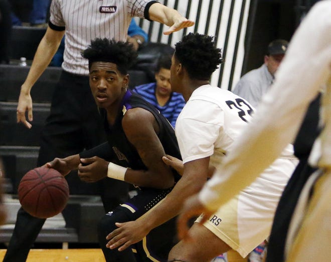Bibb County's Maleake Kersh (2) looks to move around Sipsey Valley's Isaiah Blackmon (22) during a game at Sipsey Valley High School in Buhl, Ala. on Tuesday Jan. 20, 2015. staff photo | Erin Nelson