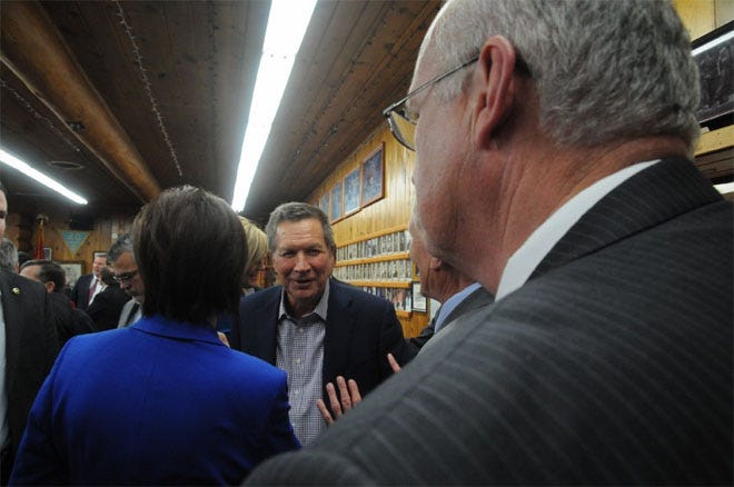 Ohio Gov. John Kasich walks through a crowd of attendees at an American Legion post in Pierre, S.D., where he called on South Dakota lawmakers to support a balanced budget amendment to the U.S. Constitution.