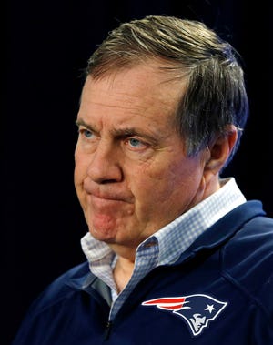 New England Patriots head coach Bill Belichick repeatedly said, "I don't have an explanation," on why the team's balls were deflated during the AFC title game Sunday. (AP Photo/Elise Amendola)