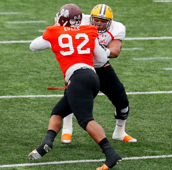 South squad defensive tackle Kaleb Eulls (92), of Mississippi State, and South squad offensive tackle La'el Collins, right, of LSU, practice for the NCAA college football Senior Bowl, Thursday, Jan. 22, 2015, in Mobile, Ala. (AP Photo/AL.com, Mike Kittrell) MAGAZINES OUT
