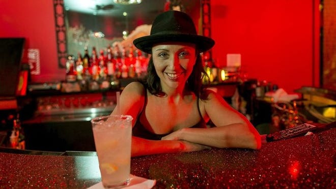Amanda Cevallos, bartender at the Jade Room, poses with her specialty drink, the vodka margarita. (RODOLFO GONZALEZ/AMERICAN-STATESMAN)