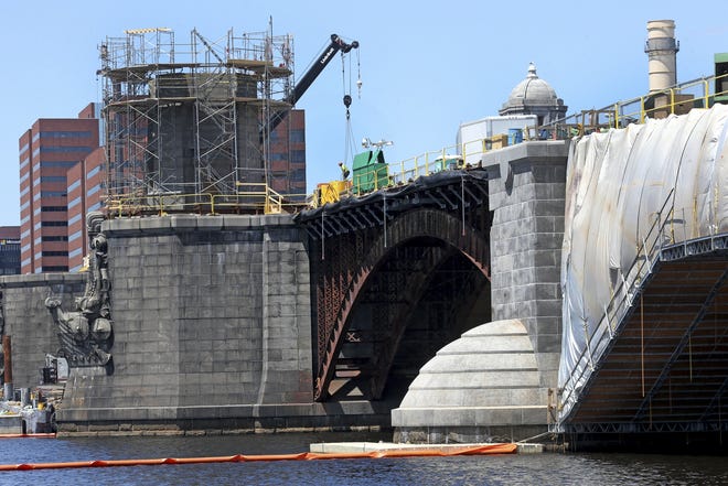 A construction crew works on the Longfellow Bridge between Boston and Cambridge in May. Massachusetts added more jobs during 2014 than in any year since 2000, the state reported Thursday.

David L. Ryan/Associated Press file