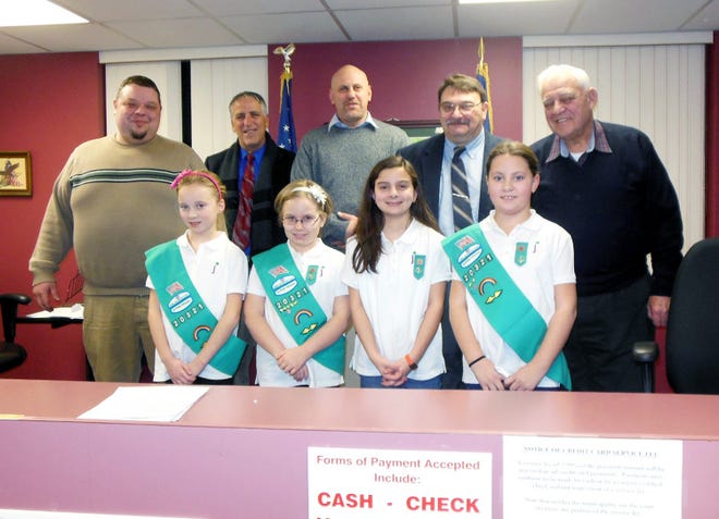 Members of a local Girl Scout troop were invited to sit with the Herkimer village board during Tuesday’s regular meeting. The girls, who are members of Troop No. 20321, are working to earn their Inside Government merit badges, according to Troop Leader Robin Nalaskowski. Shown after the meeting are, from left, front, Hannah Allison, Emily Shephard, Torri Nalaskowski and Julie Dorantes; and, back, Trustee Fred Weisser, Village Attorney Nicholas Macri, Trustee Greg Malta, Mayor Tony Brindisi and Trustee Harold Stoffolano. TIMES PHOTO/DONNA THOMPSON