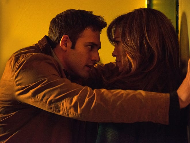 This photo released by Universal Pictures shows, Ryan Guzman as Noah seducing Jennifer Lopez as Claire Peterson in a scene from the film, "The Boy Next Door."