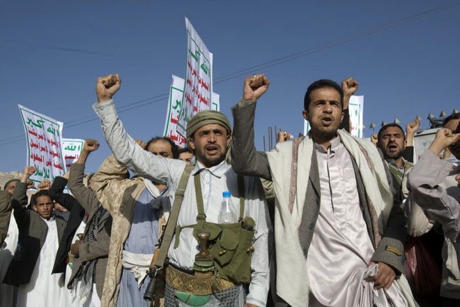 Yemeni protesters chant slogans during a demonstration to show their support for Houthi Shiite rebels in Sanaa, Yemen, on Friday. Thousands of protesters demonstrated Friday across Yemen, some supporting the Shiite rebels who seized the capital and others demanding the country's south secede after the nation's president and Cabinet resigned.