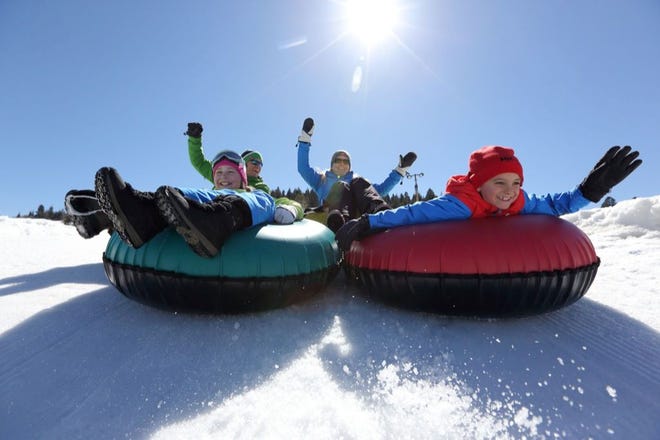 TUBING AT GORGOZA PARK in Park City, Utah, is one of many activities for having fun in the snow. Cities across the country offer snow carving and sculpture building, to name a few.