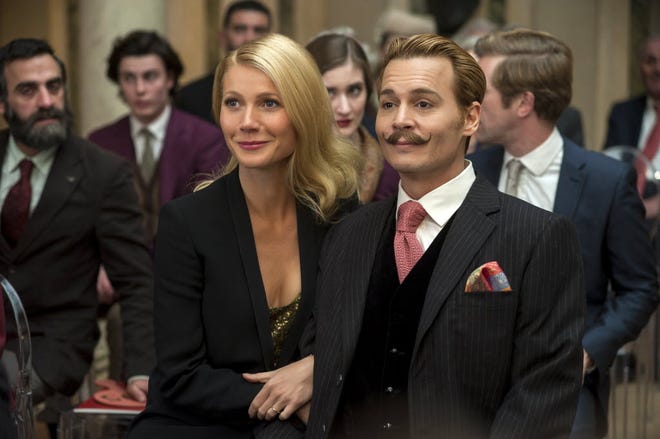 Gywneth Paltrow, left, accompanies husband and art expert Johnny Depp to an auction in the action/comedy "Mortdecai."