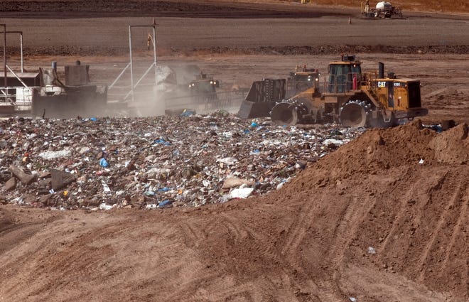 Heavy equipment moves trash around on Sept. 18, 2013, at Forward Landfill in Stockton. CLIFFORD OTO/RECORD FILE