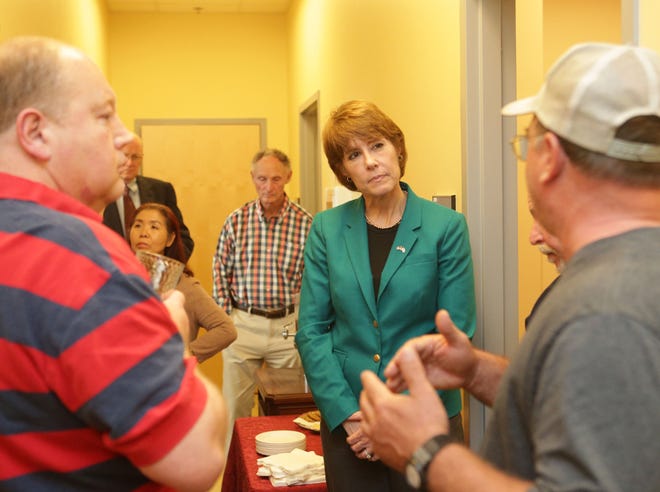 Gwen Graham listens to constituents during her open house.