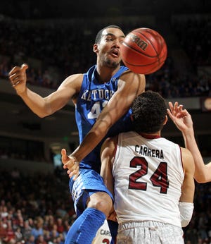 Kentucky's Trey Lyles charges into South Carolina's Michael Carrera in the second half. Lyles scored seven points as the top-ranked Wildcats defeated the Gamecocks by 15.