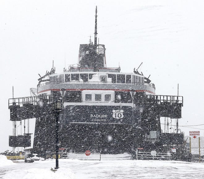 Snow blankets the area around the Lake Michigan Carferry docks and the 410-foot SS Badger in Ludington. The Lake Michigan Carferry crew is installing an ash conveyor system. The work is being done to meet EPA requirements. AP Photo