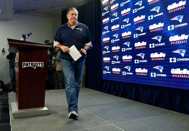 New England Patriots head coach Bill Belichick walks from the podium after a news conference prior to a team practice in Foxborough, Mass., Thursday, Jan. 22, 2015. Belichick addressed the issue of the NFL investigation into deflated footballs. (AP Photo/Elise Amendola)