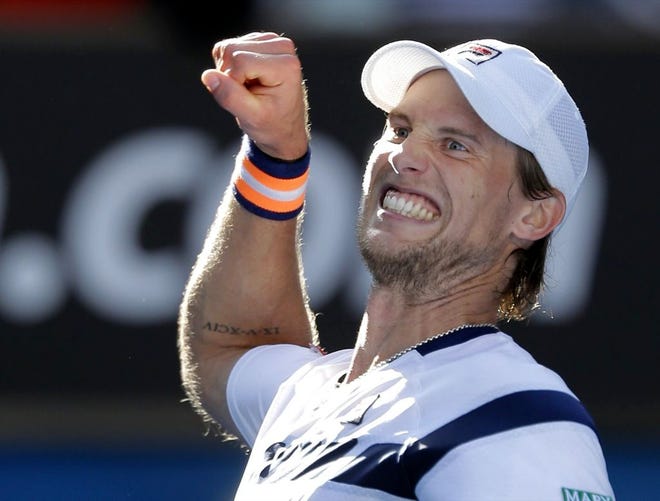 Andreas Seppi celebrates after defeating Roger Federer in their third-round match Friday at the Australian Open in Melbourne, Australia.