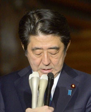Japanese Prime Minister Shinzo Abe speaks after an emergency Cabinet meeting following a new message purported to be from the Islamic State group, at his official residence in Tokyo early Sunday, Jan. 25, 2015. Japanese officials are working to verifying the new message purported to be from the Islamic State group holding two Japanese hostages. The Associated Press could not verify the contents of the message, which varied greatly from previous videos released by the Islamic State group, which now holds a third of both Syria and Iraq. (AP Photo/Kyodo News) JAPAN OUT, CREDIT MANDATORY