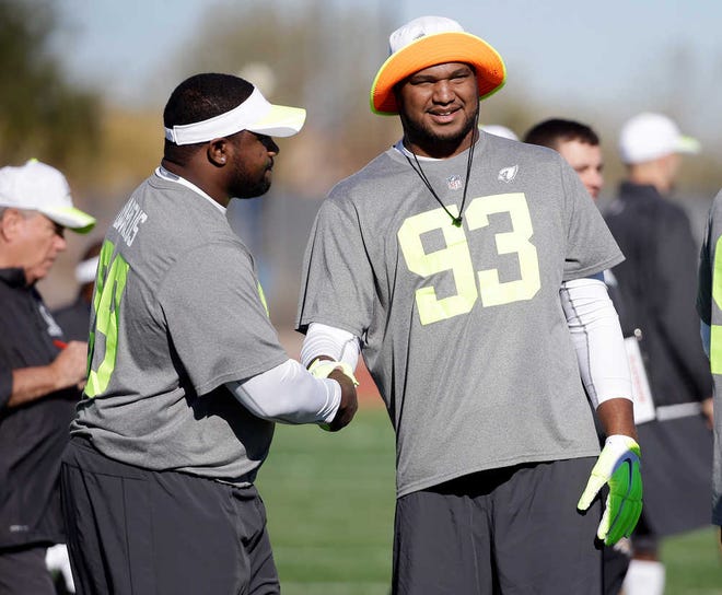 Arizona Cardinals defensive end Calais Campbell (93) greets Buffalo Bills defensive tackle Marcell Dareus, left, during practice for the NFL Football Pro Bowl Saturday, Jan. 24, 2015, in Scottsdale, Ariz. The game is scheduled to be played Sunday in Phoenix. (AP Photo/Mark Humphrey)