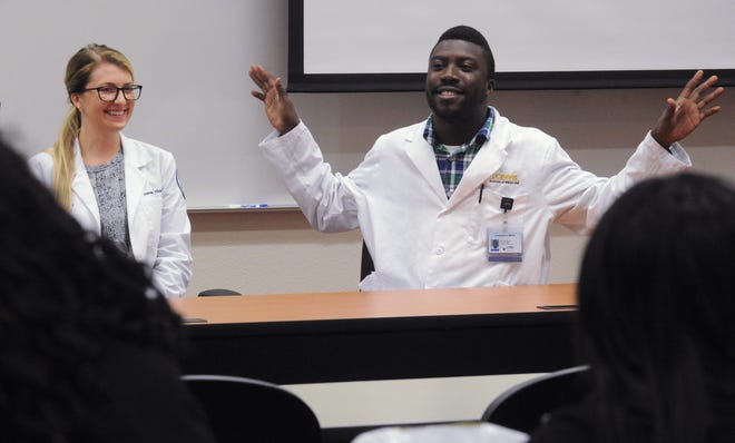 Hannah Tilden, left, and Lawrence Willis, both former Stockton residents, talk to students during a workshop Saturday at the first Health Empowerment Conference at San Joaquin Delta College. Tilden attends the Arizona College of Osteopathic Medicine, and Willis goes to UC Davis School of Medicine. CALIXTRO ROMIAS/THE RECORD