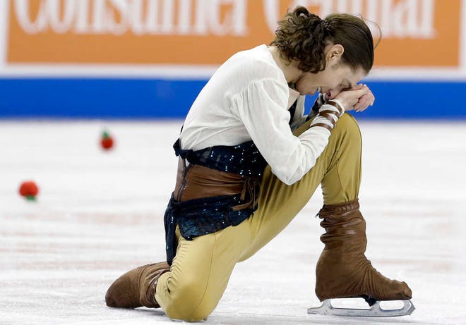 Jason Brown reacts following his performance in the men's free skate competition in the U.S. Figure Skating Championships in Greensboro, N.C., Sunday, Jan. 25, 2015. Brown won his first U.S. title, holding off Adam Rippon thanks to his big lead after the short program. (AP Photo/Gerry Broome)
