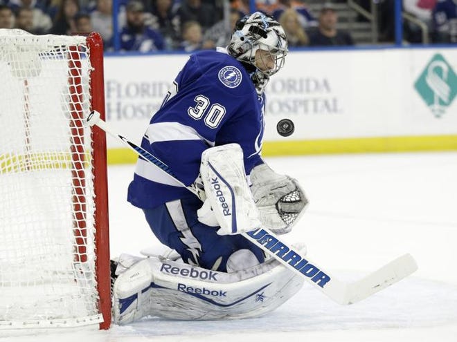Tampa Bay Lightning goalie Ben Bishop (30) makes a save on a shot by the Edmonton Oilers during the first period of an NHL hockey game Thursday, Jan. 15, 2015, in Tampa, Fla. (AP Photo/Chris O'Meara)