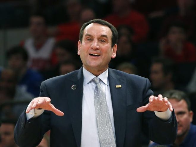 Duke head coach Mike Krzyzewski gestures to his players in the first half of an NCAA college basketball game against St. John's at Madison Square Garden in New York, Sunday, Jan. 25, 2015. Coach Krzyzewski is going for his 1,000th win. (AP Photo/Kathy Willens)