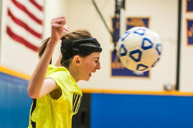 Washingtonville soccer player Jennifer Kinsley heads a soccer ball wearing a Full90 head-protection band that is used to reduce concussions. Allyse Pulliam for the Times Herald-Record