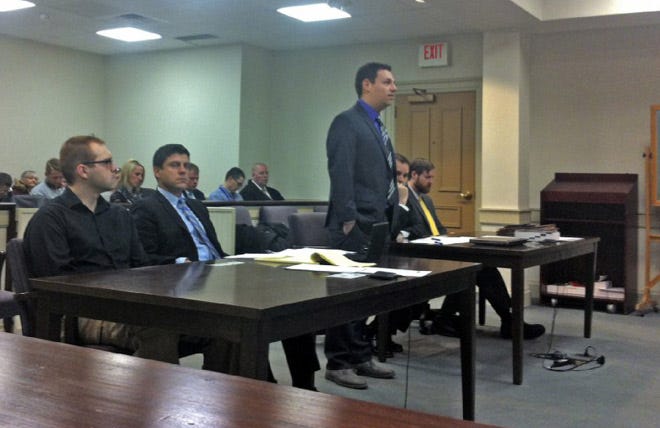 Nicholas Eber, left, listens as Anthony Peddle describes his injuries in Delaware County Common Pleas Court.