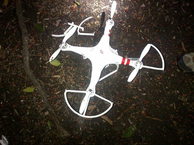 A device, possibly an unmanned aerial drone, was found on the White House grounds during the middle of the night while President Barack Obama and the first lady were in India, but his spokesman said Monday that it posed no threat. A hobbyist claimed the quadcopter, at left, that caused the unintended breach, saying hadn't meant to fly the drone over the complex, officials said.