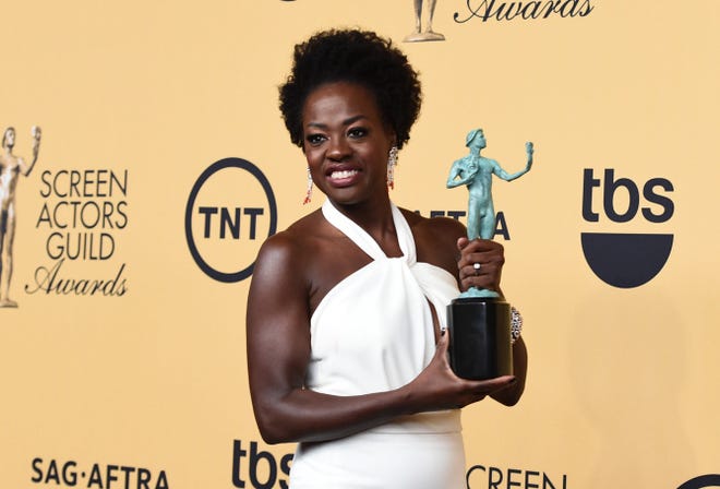 Viola Davis poses in the press room with the award for outstanding performance by a female actor in a drama series for “How to Get Away with Murder” at the 21st annual Screen Actors Guild Awards at the Shrine Auditorium on Sunday.