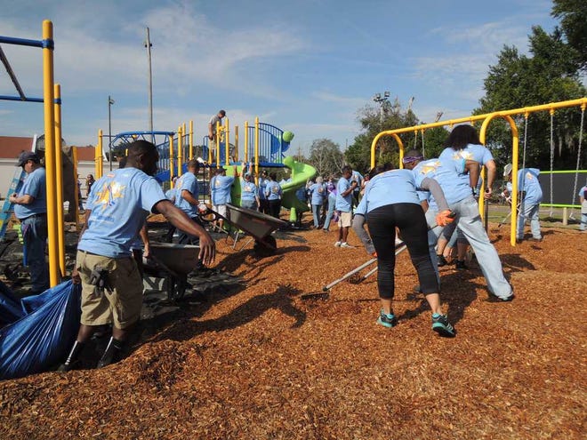 Photos by Tiffanie.Reynolds@jacksonville.com Between 200 and 250 volunteers participated to build a new playground for Long Branch Elementary School. The final design is a combination of parents' and students' input.