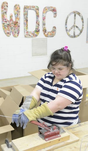 Kirstin Russo a client at the Whipple-Dale Center will need to relocate when The Stark County Board of Developmental Disabilities closes their Plain Township adult workshop location. Kirstin enjoys puzzles, cooking and working at the adult workshop. On Tuesday she was making parts for Timken Company.
