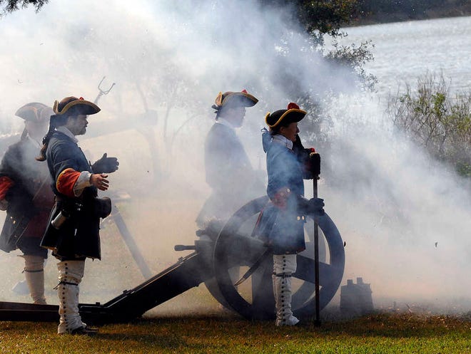 Re-enactors in the role of the Spanish garrison at the Castillo de San Marcos in St. Augustine are wreathed in smoke from a cannon they fired over the Frederica River at the Fort Frederica Festival at Fort Frederica National Monument on St. Simons Island. The Castillo de San Marcos National Monument will host special evening tours Friday providing a special glimpse into the Siege of 1740.