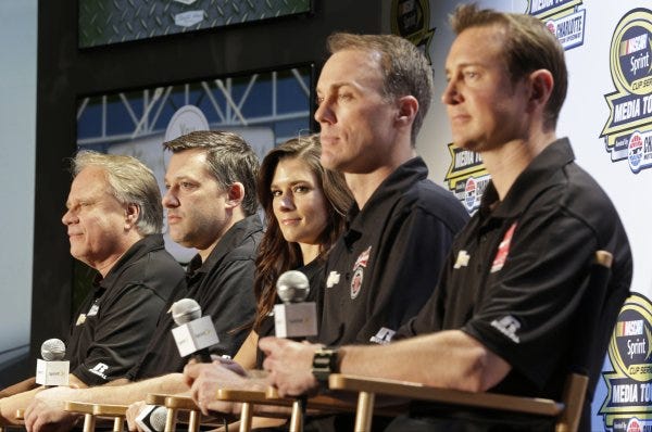 From left, Stewart-Haas Racing team members Gene Haas, Tony Stewart, Danica Patrick, Kevin Harvick, and Kurt Busch listen to a question during a news conference at the NASCAR Media Tour in Charlotte on Monday. This is a high-profile and sometimes volatile group, so team owners Haas and Stewart could have their hands full - and they could have a very successful year.