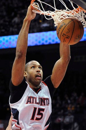 Atlanta center Al Horford dunks during the victory over Brooklyn on Wednesday night. Horford had 20 points and 12 rebounds as the Hawks extended their winning streak.