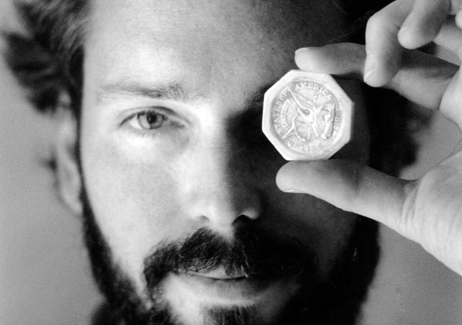 In this November 1989 file photo, Tommy Thompson holds a $50 pioneer gold piece retrieved earlier in 1989 from the wreck of the gold ship Central America. According to the US Marshals Service, Thompson, a fugitive treasure hunter wanted for more than 2 years was arrested in Florida.