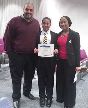 Nicholas Harvey III, center, receives third place for his essay on childhood obesity in a contest sponsored by Vidant Health. He and his parents, Nick and Erin Harvey, of Kinston are being featured on North Carolina Now tonight at 7:30 p.m. for their participation in Eat Smart, Move More, a statewide healthy eating and fitness program.