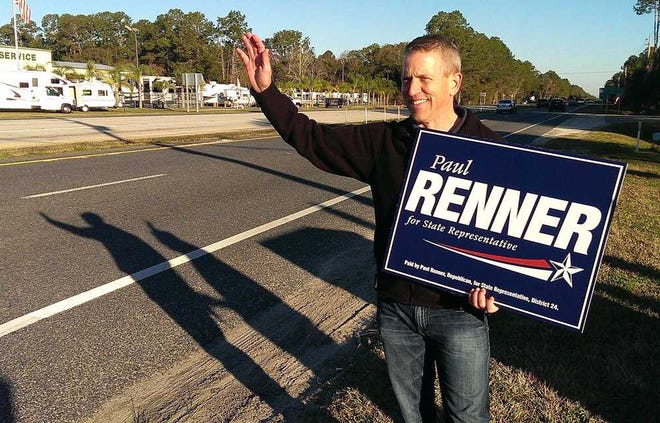 PETER.WILLOTT@STAUGUSTINE.COM Paul Renner, candidate for Florida state representative district 24, waves to motorists on the corner of U.S. 1 and S.R. 206 early on Tuesday (January 27, 2015) morning.