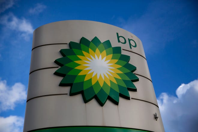 A BP logo is seen outside a petrol station in the town of Bletchley in Buckinghamshire, England, Thursday, Jan. 15, 2015.  (AP Photo/Matt Dunham)