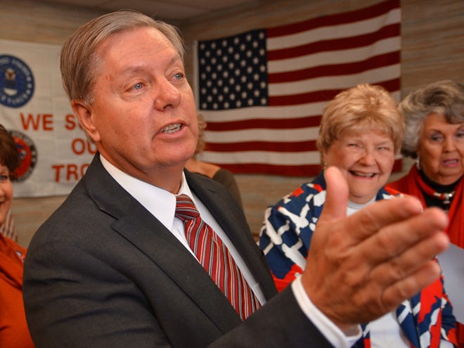 Sen. Lindsey Graham speaks with supporters and volunteers during a stop at the Spartanburg GOP women's group office in Spartanburg in October.