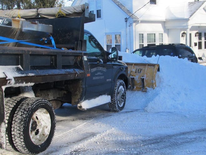 Snow plows widen a side street in Somerset after the blizzard that struck earlier this week.