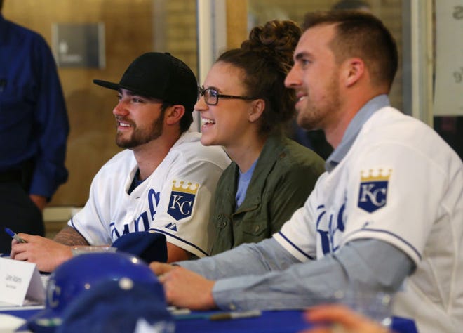 Lauren Darby has her picture taken with Royals players Brandon Finnegan and Lane Adams during the Royals Caravan stop Thursday, Jan. 29, 2015 at the Student Union on the Hutchinson Community College campus.