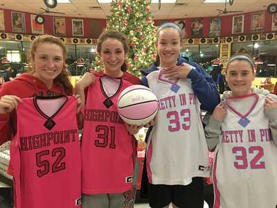 Photo courtesy of High Point H.S. — High Point High School girls basketball team captains Madalyn Smith and April Peterson, left, are the hosts of the annual fund-raising game set for Saturday. This year’s visiting team is Sparta High,