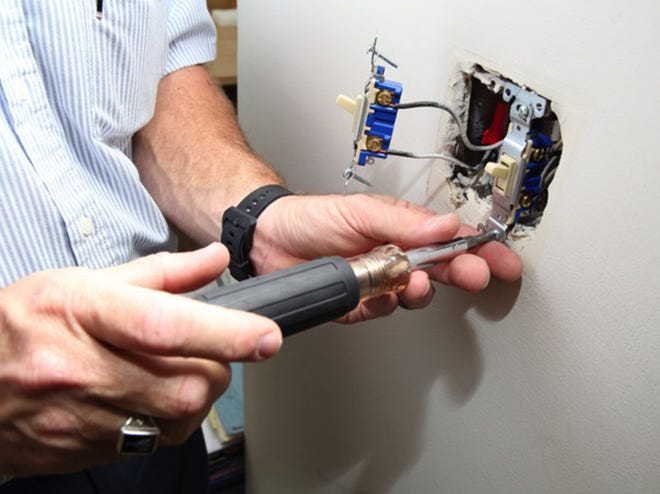 Before hiring an electrician, verify the company's trade license and staff training.