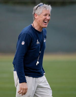 Seattle Seahawks coach and Pacific alum Pete Carroll laughs during a team practice for Super Bowl XLIX on Wednesday in Tempe, Ariz. The Seahawks play the New England Patriots on Sunday. Carroll played football at Pacific in 1971-72 and coached there from 1973-76 and 1983. MATT YORK/AP