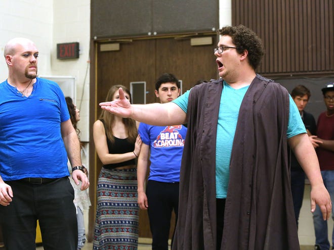 The cast of the UF Opera Theatre production of “The Phantom of the Opera,” with Jonathan Gravely as Firmin, left, and Joshua Mazur as the Phantom, is shown rehearsing a scene on the UF campus.