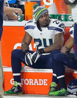 FILE - In this Dec. 21, 2014, file photo, Seattle Seahawks running back Marshawn Lynch watches from the sideline during the first quarter of an NFL football game against the Arizona Cardinals in Glendale, Ariz. No more Skittles, no more Beast Mode and no more avoiding the media. Is it possible that Lynch will retire after the Super Bowl? (AP Photo/Rick Scuteri, File)