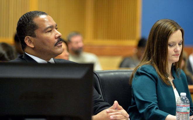 Dexter Scott King sits with the estate's attorney Nicole Wade during a hearing over who owns the Rev. Martin Luther King Jr.'s 1964 Nobel Peace Prize medal and traveling Bible on Tuesday, Jan. 13, 2015 in Fulton County Superior Court in Atlanta. King's estate, which is controlled by his sons, last year asked a judge to order King's daughter to surrender the items. In a board of directors meeting, Martin Luther King III and Dexter Scott King voted 2-1 against Bernice King to sell the two artifacts to a private buyer. (AP Photo/Atlanta Journal-Constitution, Kent D. Johnson) MARIETTA DAILY OUT; GWINNETT DAILY POST OUT; LOCAL TELEVISION OUT; WXIA-TV OUT; WGCL-TV OUT