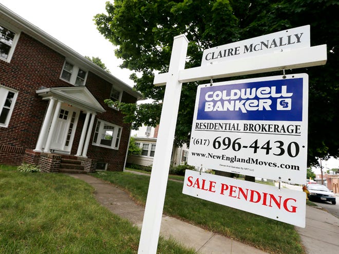 A sale pending sign is posted in front of a home for sale on July 10, 2014, in Quincy, Mass. The National Association of Realtors said Thursday that its seasonally adjusted pending home sales index fell 3.7 percent last month to 100.7.