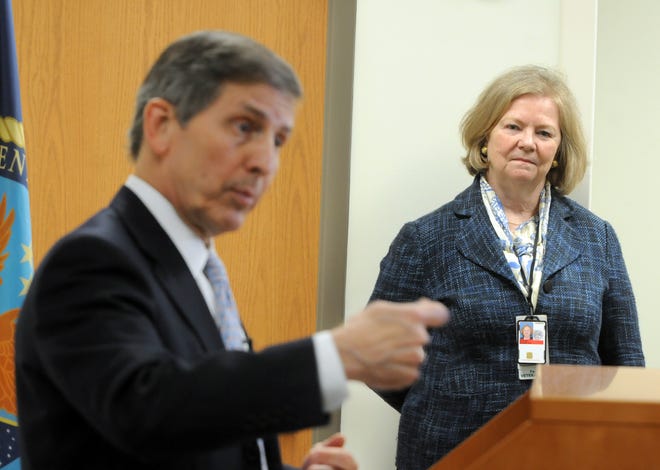 Elizabeth Goolsby, medical center director of the Fayetteville VA system, right, listens as Deputy Secretary of Veterans Affairs Sloan D. Gibson answers question from the media during a press conference at the Wilmington VA Health Care Center in Wilmington on Friday.