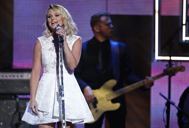 FILE - In this Dec. 2, 2014 file photo, Miranda Lambert performs during the CMT Artist of the Year Awards at the Schermerhorn Symphony Center in Nashville, Tenn. The ACMs announced Friday, Jan. 30, 2015, that Lambert is the top contender, including a nomination for entertainer of the year, pitting her against top-billing male stars Garth Brooks, Luke Bryan, Jason Aldean and Florida Georgia Line. Lambert is also nominated for album of the year for “Platinum” and female vocalist of the year. (Photo by Wade Payne/Invision/AP)